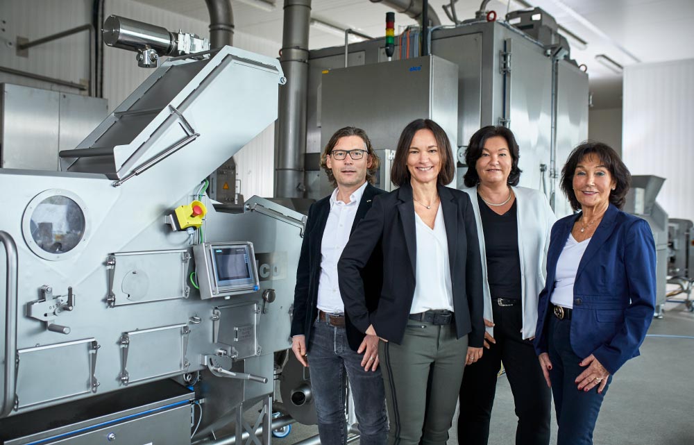 family members in front of a an alcoholic machine